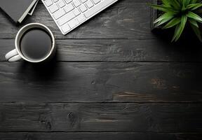 Cozy workspace with coffee cup, keyboard, and potted plant on rustic wooden table photo