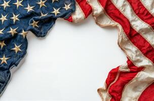 Worn American flag with faded colors displayed against a rustic background photo