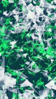 Abstract chaotically moving polygons of white and green colors on dark blue background. Animation. Green sphere of small triangles rotating and glowing, seamless loop. video