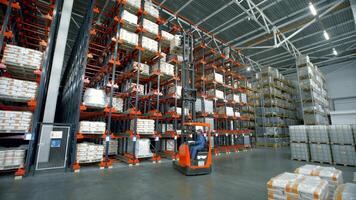 Madrid-Spain, October 8, 2022. Creative.A large bright warehouse with working equipment where the packed ordered goods are laid out. video