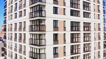 Flying close to the new multi storey building with balconies and big windows. Stock footage. Buildings of the city sleeping area. video