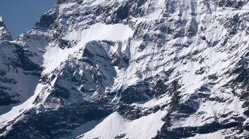 Alps cold mountain slopes. Creative. Snow and ice covered cliffs and rocks. video