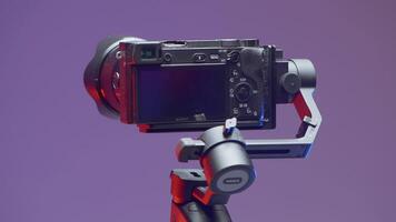 Sony camera accessories. Action. A rotating tripod for shooting with an attached camera on a purple background. video