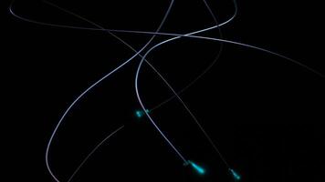 Curved vertical lines with moving balls. Design. Metal spiral lines with moving balls on black background. Balls descend along curved lines video