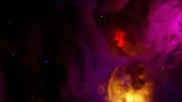 Cosmic Colorful Nebula. Design. Moving colorful fog in outer space. Colorful nebula of space in beautiful stream on black background video