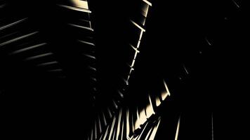 Moving 3d metal lines in dark. Design. Close-up of metal lines rotating in dark. Metal spiral with light reflection moves in dark video