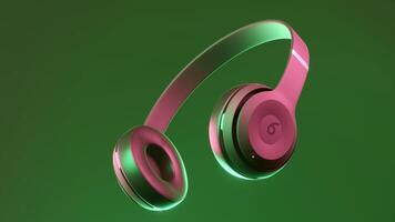 Abstract rotating headphones. Design. Beats Electronics, monster beats new headphones isolated on a colorful background. For editorial use only. video