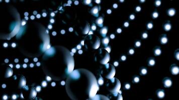 Balls move in lines in space. Design. Chains of balls move in space on black background. Metal balls move in lines in web video