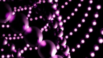 Balls move in lines in space. Design. Chains of balls move in space on black background. Metal balls move in lines in web video