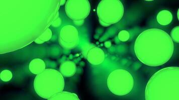 Black background. Design.Different sizes of green light color glitters in different parts of the backgrounds fly to different places. video