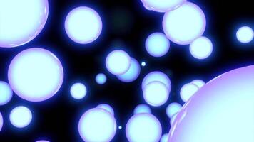 Illuminated blue and purple bubbles. Design. Black background with reflective circles that fill all black space in abstraction. video