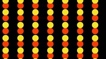 Jumping colorful circles creating nauseous effect. Design. Small spheres moving fast up and down in vertical rows on a black background. video