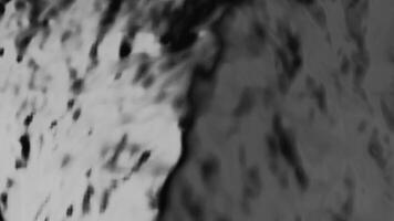 Gray mud. Design. Dark background with dirt that rises up in the animation. video