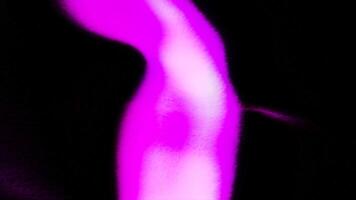 Black background with green and purple light in animation and. Motion. A walking bright lantern dissolving in different directions. video