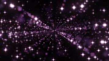 Black background. Design.Bright bright animation with purple and pink particles flying around that fly in different directions. video