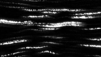 Black background with neon lines running in different directions. Motion. Dark background with bright illumination made in cartoon abstraction. video
