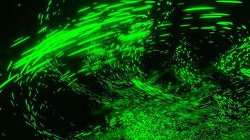 Black background. Design.Different sizes of green light color glitters in different parts of the backgrounds fly to different places. video