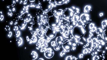 Black background. Design.Bright gold and purple bubbles splash in different directions under great pressure in the animation. video
