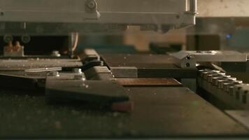 Close-up of automated machine for wooden boards. Creative. Modern automated machine for wooden boards. Industrial machine moves according to given installation video