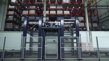 Poland, Warsaw- September 14, 2022. Automated conveyor in warehouse. Creative. Conveyor in warehouse for distribution of cargo on shelves. New automated cargo unloading system in warehouse video