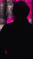 View from the back of man looking at the colorful paintings rotating on the rolls in the museum of Modern Art. Concept. Gallery in Saint Petersburg video