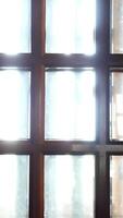 VIew inside of historical museum, glass window with wooden partitions and ancient documents hanging on the wall in frames. Stock footage. Reconstruction of historical events and places at the museum. video