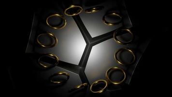 Black background with blue and gold rings. Design. Rotating in a circle small rings made in abstraction. video