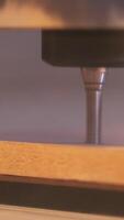 Close-up of wood cutting machine controlled by computer while he is carving wood. Action. CNC milling machine carving a wooden part blank. video