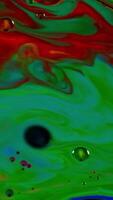 Abstract colorful paint reactions, psychedelic liquid light show, dye patterns in water, oil, paint. Stock footage. Marble background ink explosion, kaleidoscope or LSD effect. video
