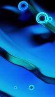 Neon bubbles move on surface of liquid. Design. Bright neon bubbles move on ripples of liquid. Beautiful bubbles move on abstract blurred liquid video