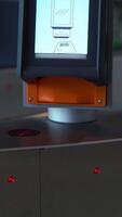 Close-up of passing through electronic turnstile with barcode scanner. Media. Using smartphone to get access inside the building. video
