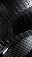Abstract metal spinning stripes on a black background, monochrome. Design. Long tangled mechanism. video