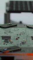 Coating machine for printed circuit board at work. Creative. Close up of automated robotic mechanism making circuit board. video