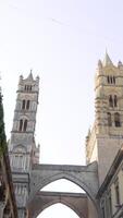 Street under two towers of Cathedral. Action. Beautiful European street with view of two towers of Cathedral connected by bridge video