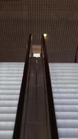 Empty moving staircase running up and down. Media. Modern indoor escalator stairs. video