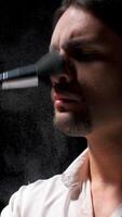 Man applies powder to his face with brush. Stock footage. Man puts powder on face on theater stage. Theatrical production with one man putting powder on face video