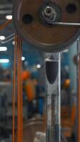 Industrial machine with rotating coils and wire. Creative. System with coils of tensioning wires on industrial machine. Industrial machines with wires in factory video
