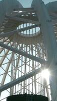 Dome construction of building. Stock footage. Beautiful frame construction of white dome on building. Modern architecture of building with through dome frame on background sky video