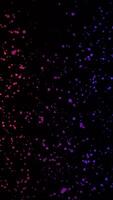 Neon colored dots moving in space. Animation. Abstract animation of moving colored neon dots on a black background video