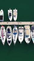 parte superior ver de barcos en procida, Italia, el más popular turista atracciones en el playa. acción. yate estacionamiento, yate y velero es amarrado a el muelle video