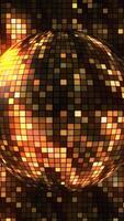 Abstract animated pixel background with a spinning golden glow disco ball. Motion. A sphere composed of cubes crystals with shinny streaks of light and shards of crystals rotating around and video