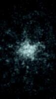 Chaotic white glowing particles on black background. Animation. White energy particles gather into single glowing sphere. Energy or biological particles video
