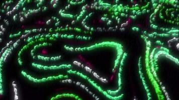 Black background with bright yellow and green backlight. Motion.Bright background with burning particles around in animation. video