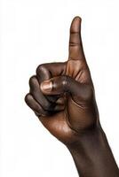 A persons hand giving a thumbs down gesture against a white background photo