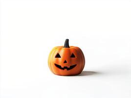 A carved pumpkin with a smiling face on a plain white background for Halloween decoration photo
