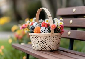A wooden basket with flowers on it sitting on a bench photo