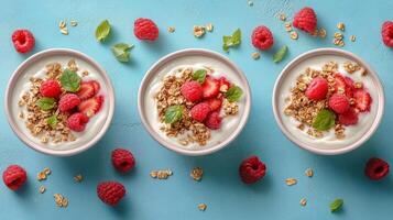 Healthy yogurt bowls with strawberries and raspberries on colorful background photo