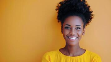 Smiling Woman With Curly Hair in Yellow Top Against Vibrant Yellow Background photo