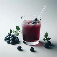 Refreshing Blueberry Juice with a Straw and Fresh Leaves photo