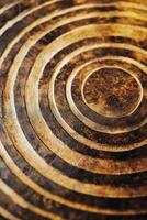 Intricate golden spiral patterns on a textured surface showcasing artistic craftsmanship photo